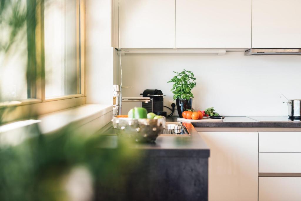 A kitchen or kitchenette at Schneeweiss lifestyle - Apartments - Living
