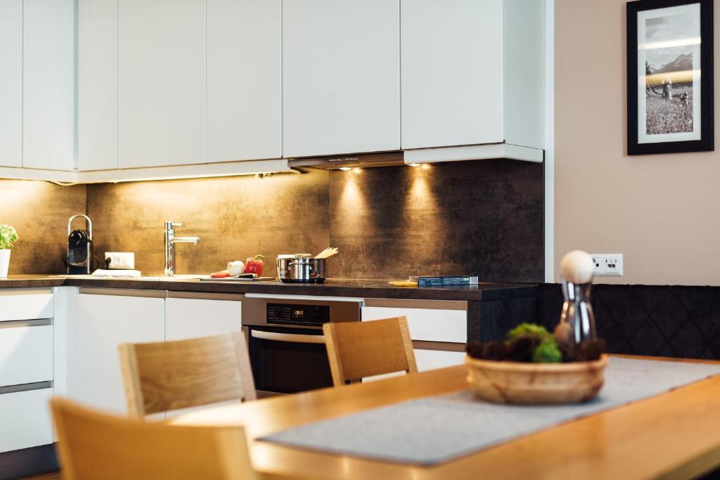 A kitchen or kitchenette at Schneeweiss lifestyle - Apartments - Living