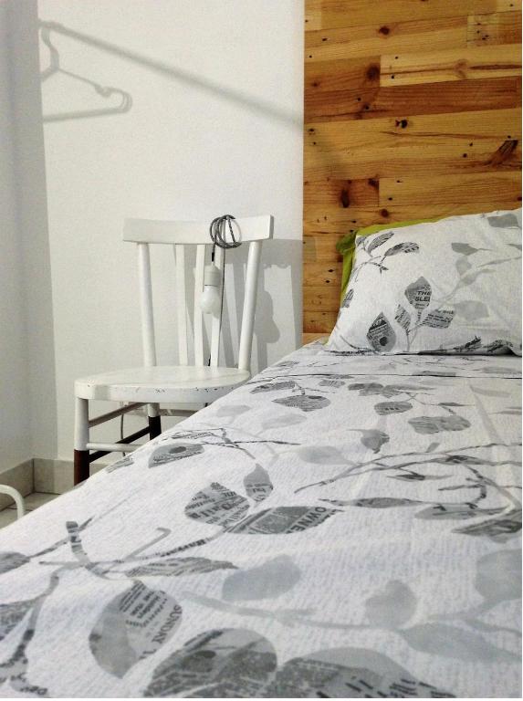 A bed or beds in a room at Alloggio OpenSpace da Irene