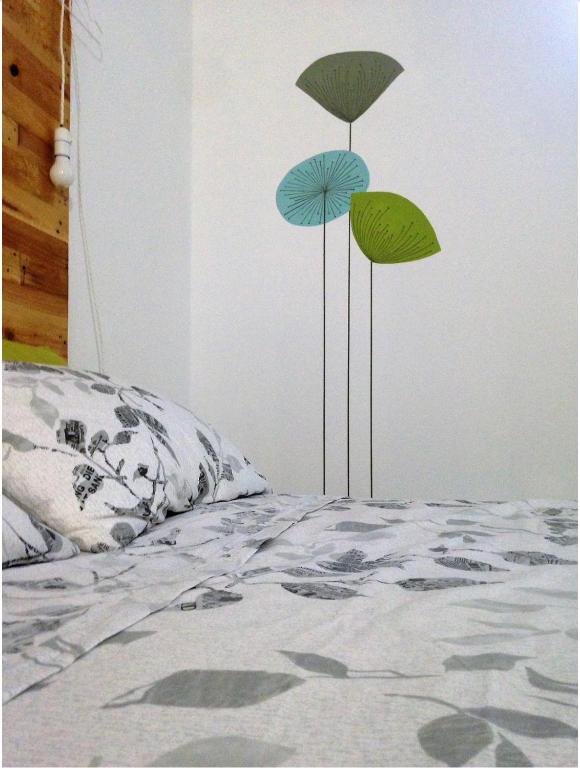 A bed or beds in a room at Alloggio OpenSpace da Irene