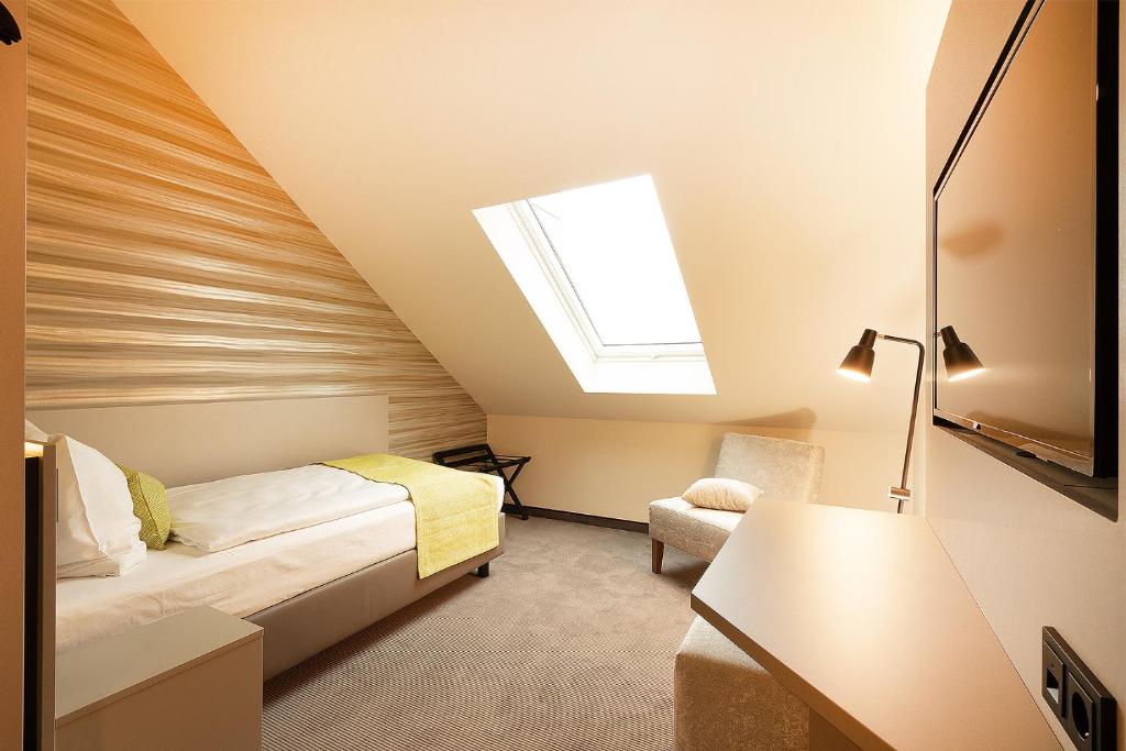 TV a/nebo společenská místnost v ubytování th Hotel Leipzig Messe