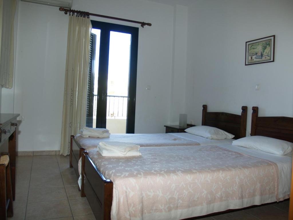 Postel nebo postele na pokoji v ubytování Irida Apartments -EX BLAZIS HOUSE