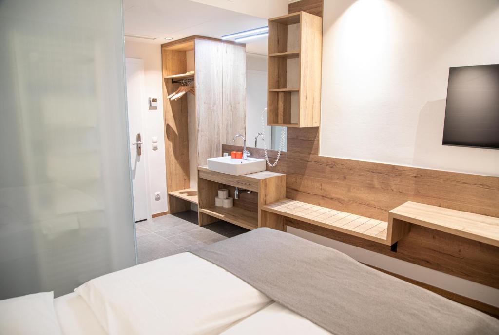 Postel nebo postele na pokoji v ubytování Hotel Restaurant Auerhahn