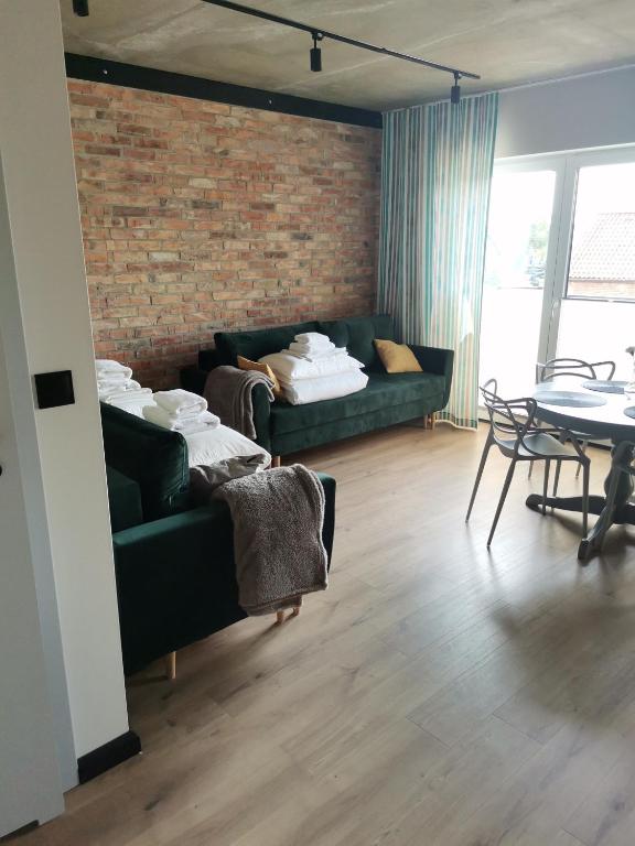 Postel nebo postele na pokoji v ubytování Topaz Apartamenty