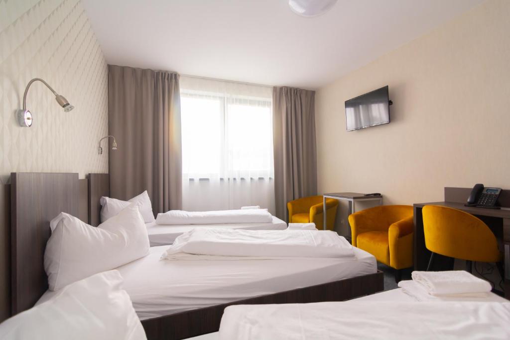 Postel nebo postele na pokoji v ubytování Lifestyle Hotel Leithana