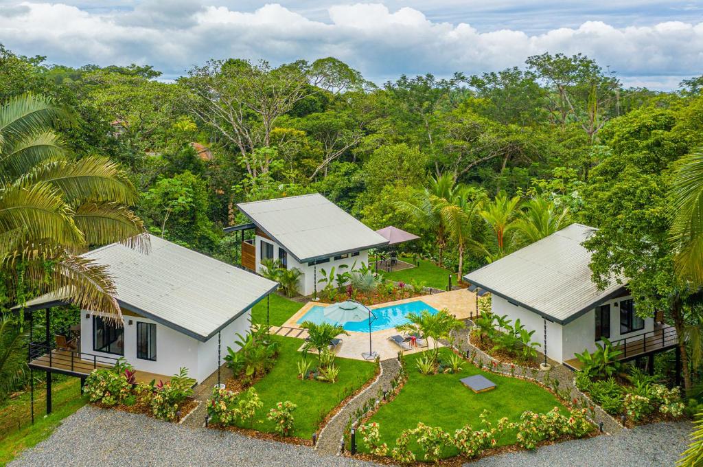 an aerial view of a house with a swimming pool at The Sutton - Boutique Jungle Experience in Uvita