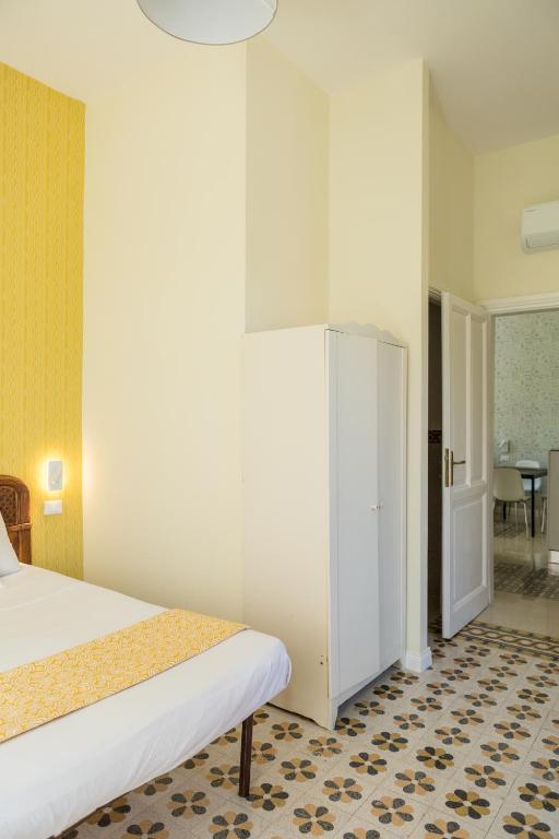 Łóżko lub łóżka w pokoju w obiekcie RomAntica Family Apartment near San Giovanni