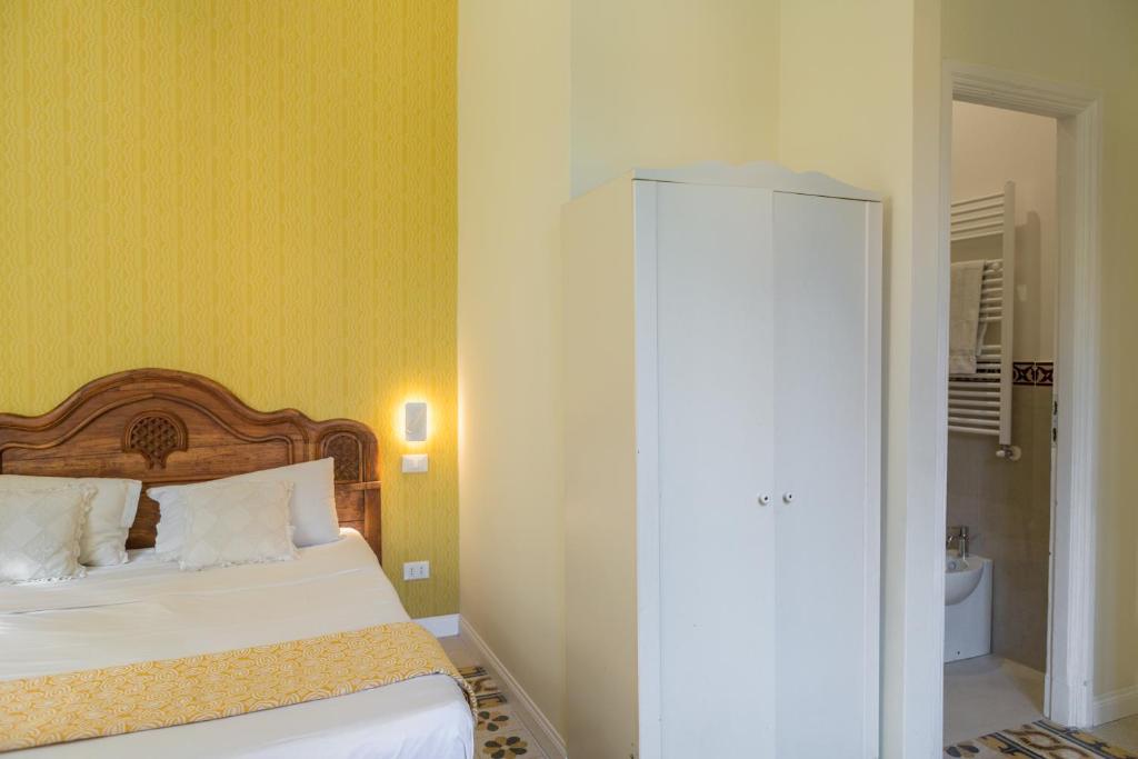 Łóżko lub łóżka w pokoju w obiekcie RomAntica Family Apartment near San Giovanni