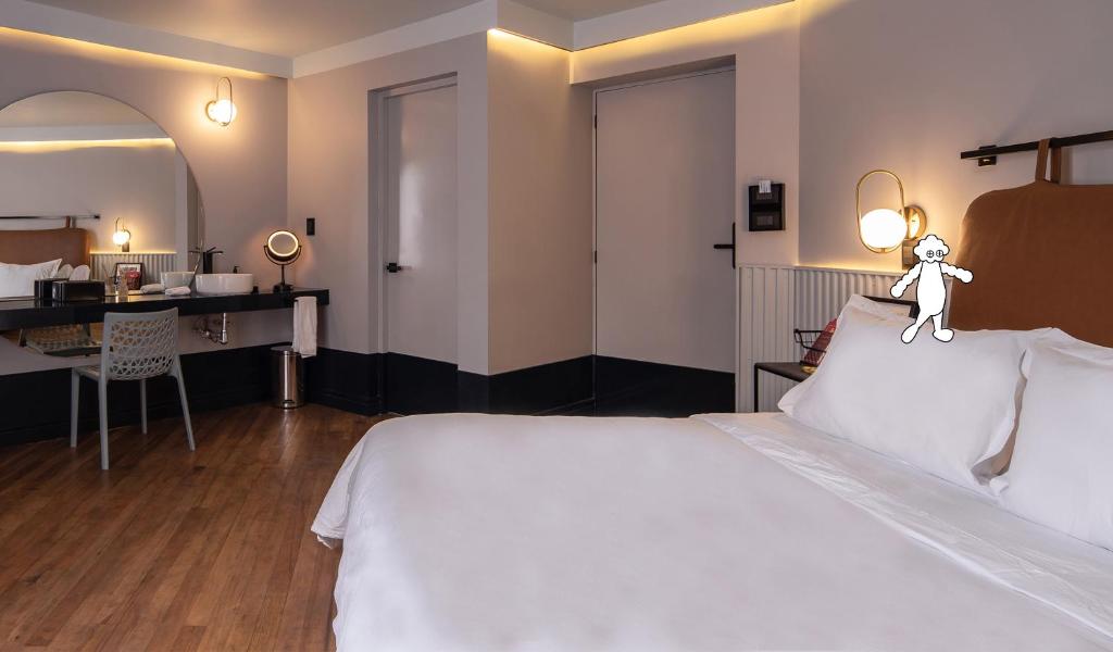 Postel nebo postele na pokoji v ubytování Casa Nada Hotel