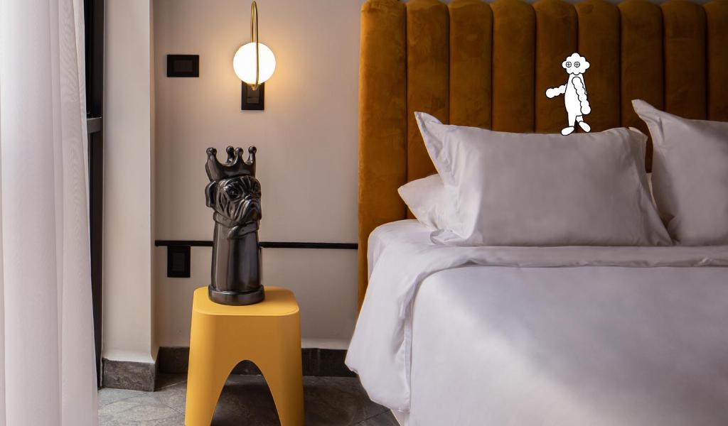 Postel nebo postele na pokoji v ubytování Casa Nada Hotel