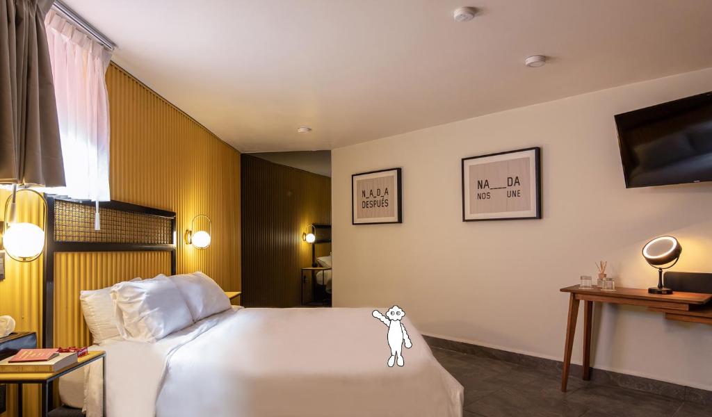 Postel nebo postele na pokoji v ubytování Casa Nada Hotel