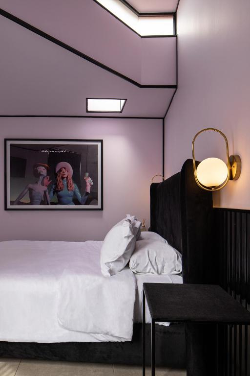 Postel nebo postele na pokoji v ubytování Casa Nada Hotel