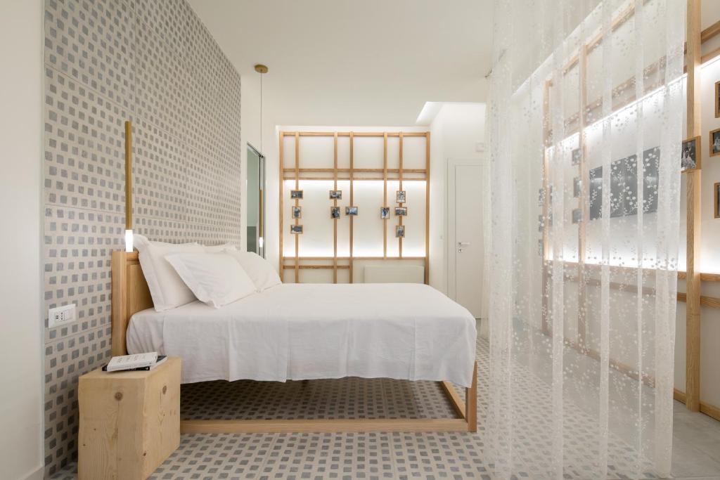 Postel nebo postele na pokoji v ubytování Terra del Sasso Suites - Design Architetto Salvatore Spataro