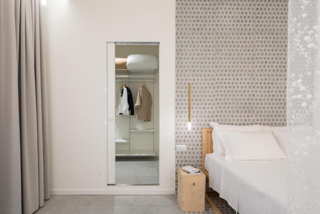 Postel nebo postele na pokoji v ubytování Terra del Sasso Suites - Design Architetto Salvatore Spataro