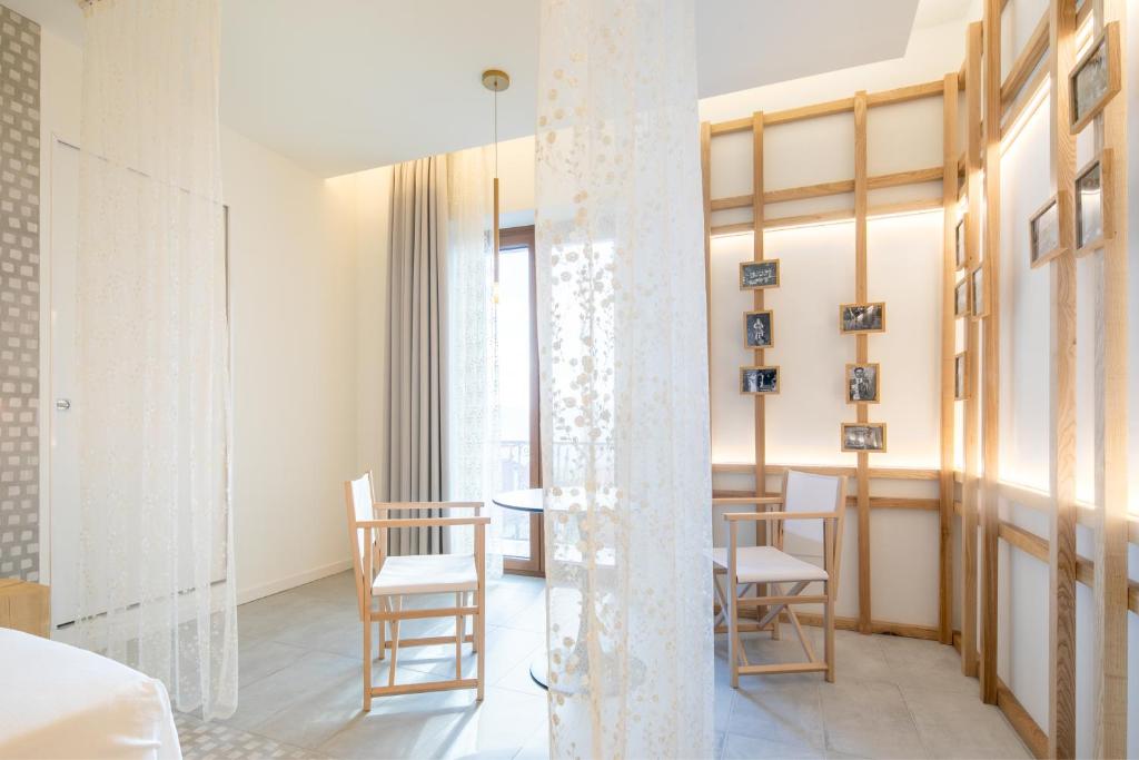 Postel nebo postele na pokoji v ubytování Terra del Sasso Suites - Design Architetto Salvatore Spataro