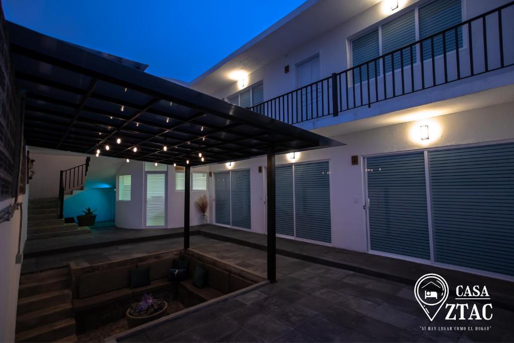 a view of a house with a patio at night at Casa Iztac in Zacatlán
