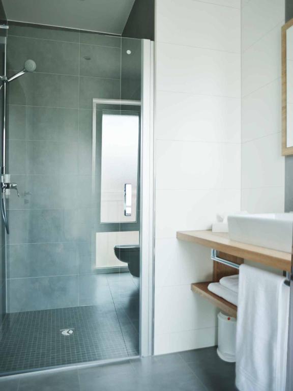 Koupelna v ubytování R & J Hotel