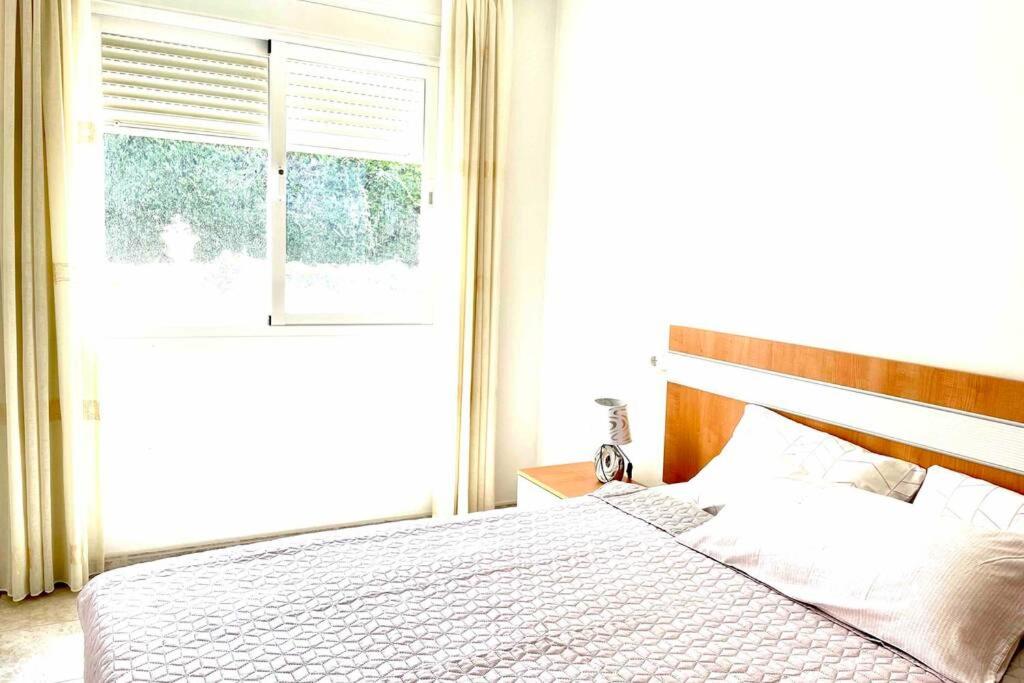 Posteľ alebo postele v izbe v ubytovaní Apartamento familiar 2 habitaciones - Terrazas-WiFi