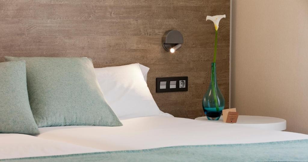 Postel nebo postele na pokoji v ubytování Hotel Dos Rios Central