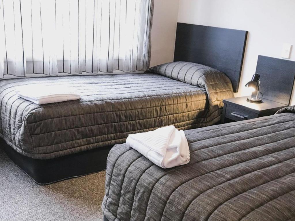 Postel nebo postele na pokoji v ubytování Harbour View Motel