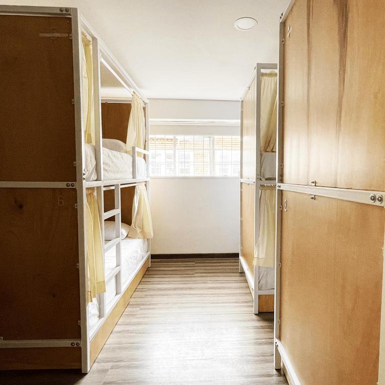 Postel nebo postele na pokoji v ubytování Hostal Macondo Bogotá