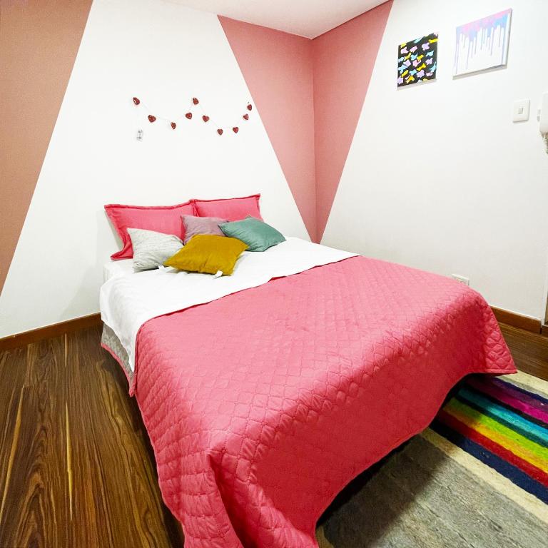 Postel nebo postele na pokoji v ubytování Hostal Macondo Bogotá