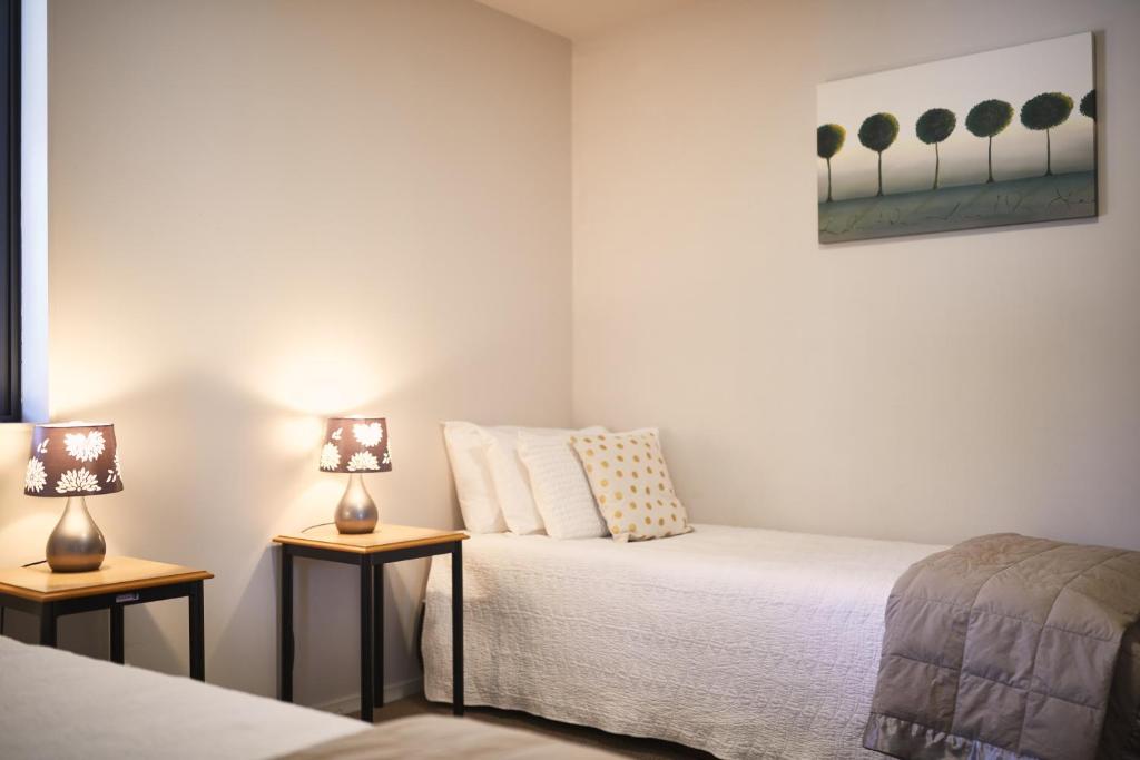 Postel nebo postele na pokoji v ubytování Blenheim Palms Motel