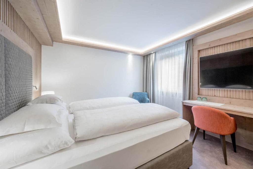 Postel nebo postele na pokoji v ubytování Hotel Bellevue - 4 Sterne superior