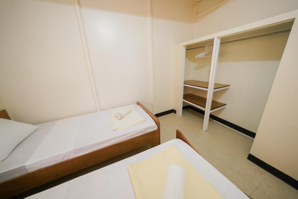 Postel nebo postele na pokoji v ubytování Yogi-Homestay
