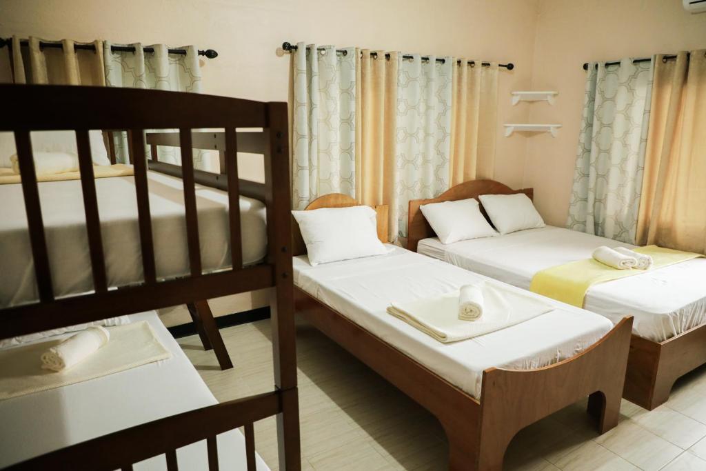 Postel nebo postele na pokoji v ubytování Yogi-Homestay