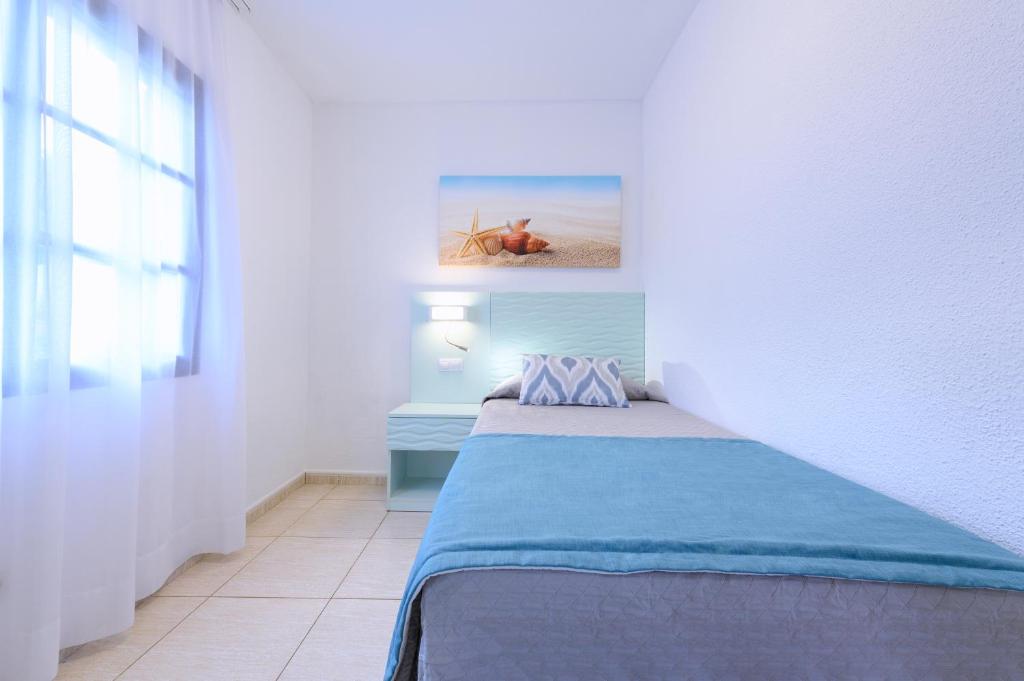 Postel nebo postele na pokoji v ubytování Valle Marina Apartamentos
