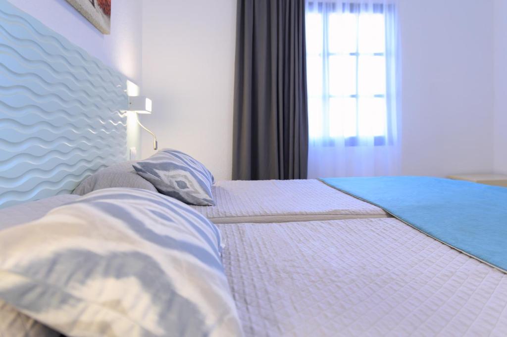 Postel nebo postele na pokoji v ubytování Valle Marina Apartamentos