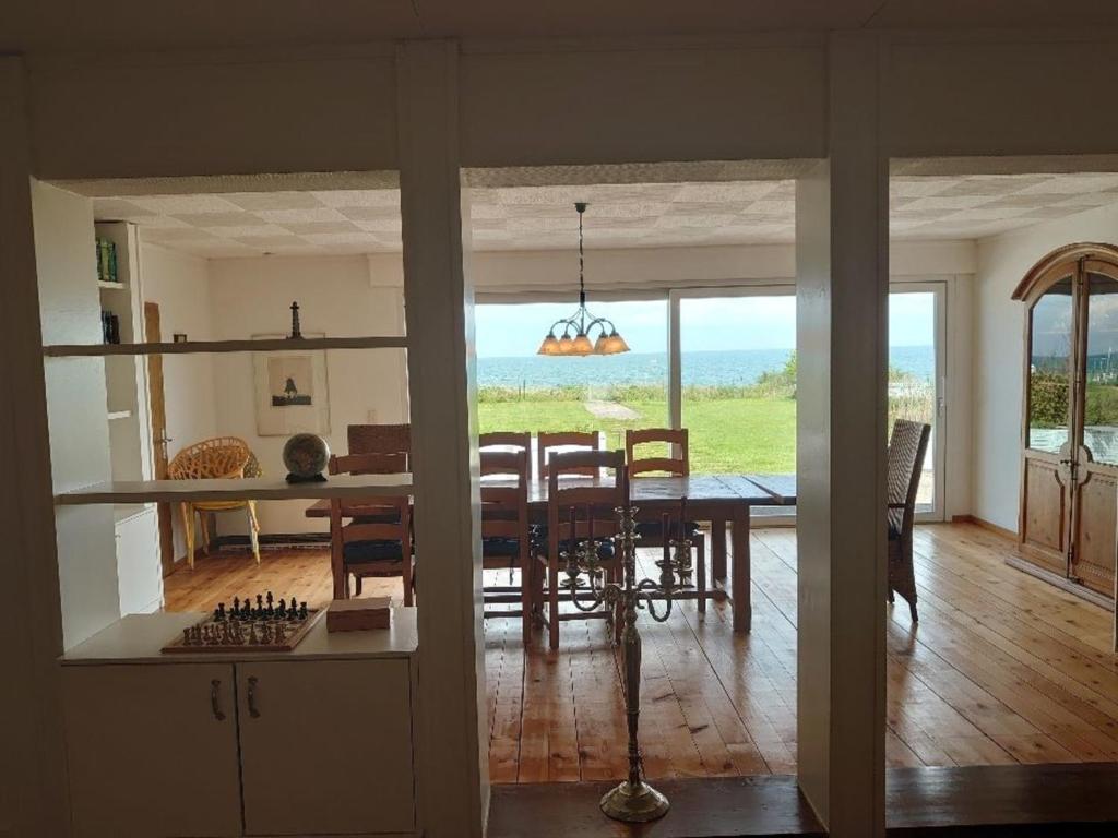 a kitchen and dining room with a table and chairs at Ostsee Huus in Burg auf Fehmarn