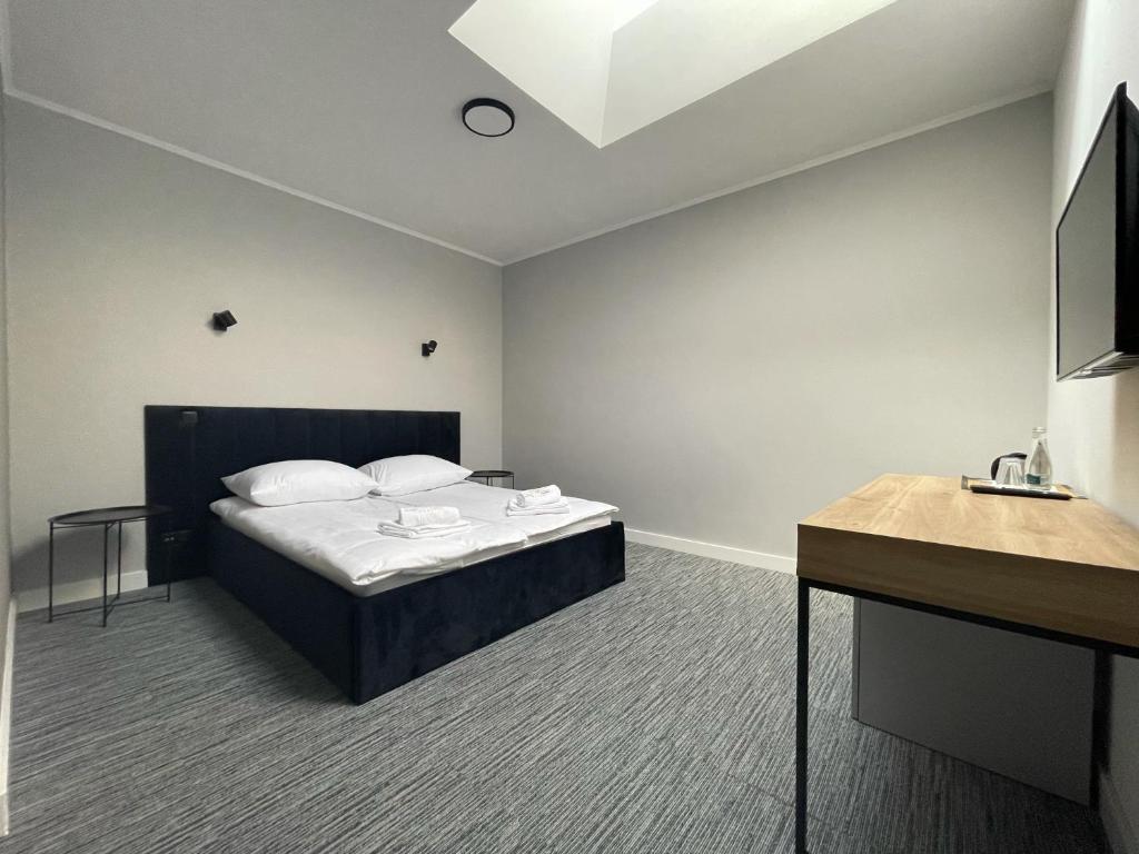 Posteľ alebo postele v izbe v ubytovaní Hotel Made in Napoli by Siervo Międzybórz