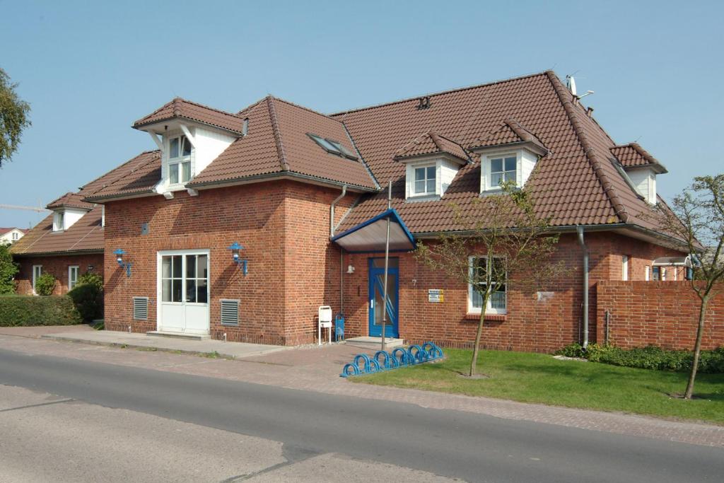 a brown brick house with a brown roof at Altes Wasserwerk, FW 7 in Zingst
