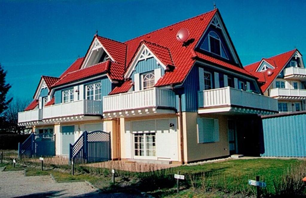 a large house with a red roof at Villa Vogelsang, Pier 6 in Zingst