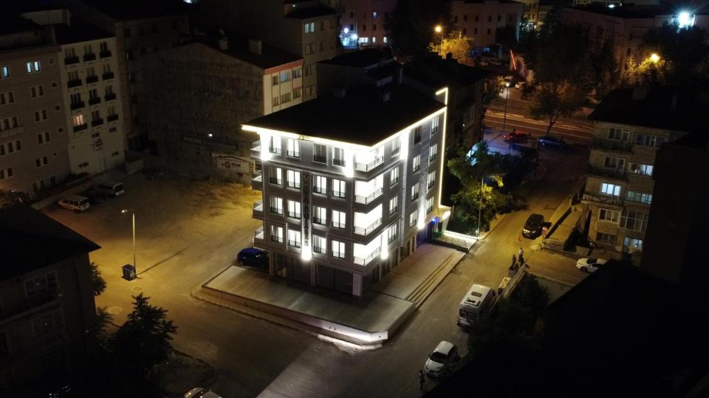 a lit up building in a city at night at Viva Suites Cappadocia in Nevşehir