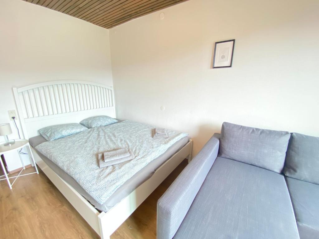 Posteľ alebo postele v izbe v ubytovaní Velden Living Apartments - Schiefling Panorama