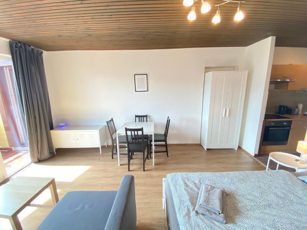 Posteľ alebo postele v izbe v ubytovaní Velden Living Apartments - Schiefling Panorama