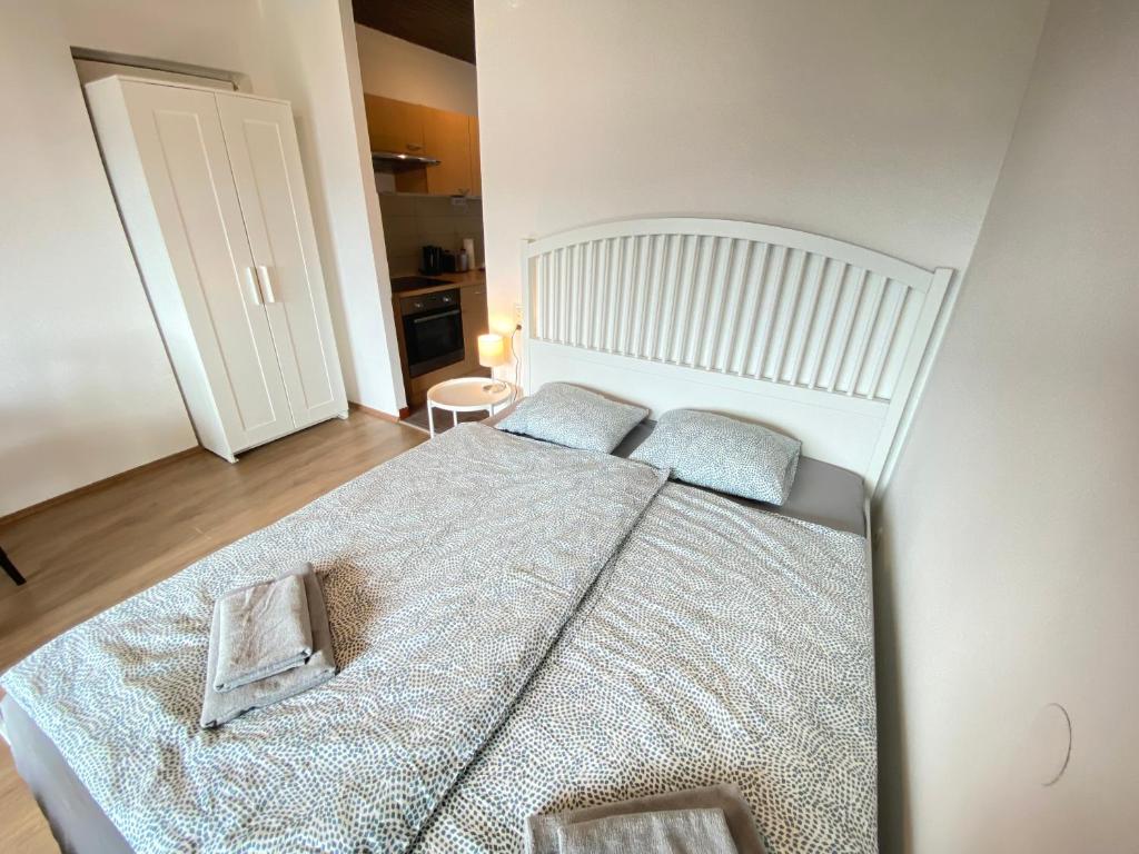 Posteľ alebo postele v izbe v ubytovaní Velden Living Apartments - Schiefling Panorama
