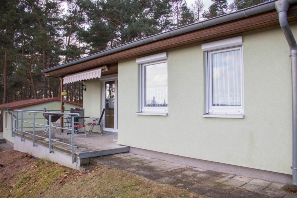 a house with a porch and a patio at Ferienhaus Marie- Louise in Feldberg