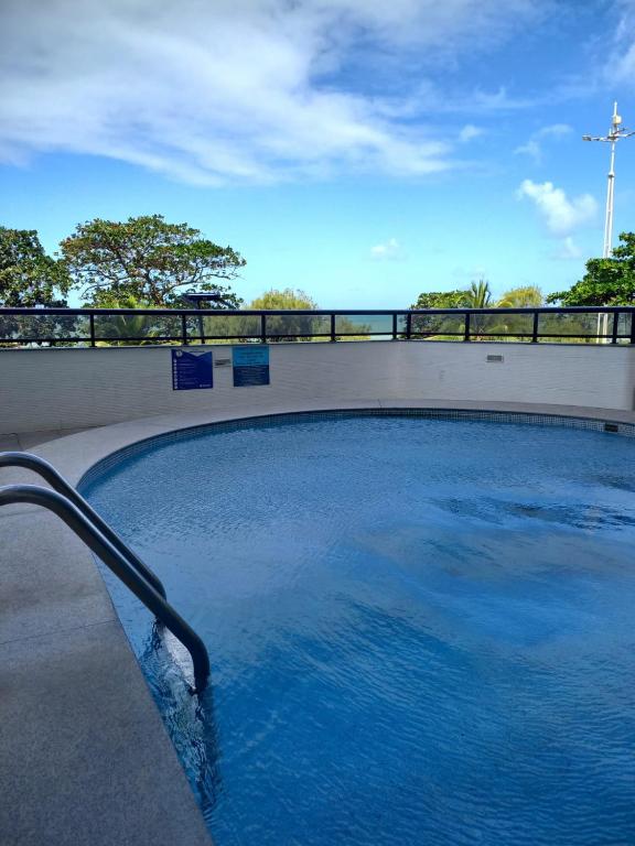 a swimming pool with a hose in the water at Hotel Euro Suíte Recife Boa Viagem By Nacional Inn in Recife