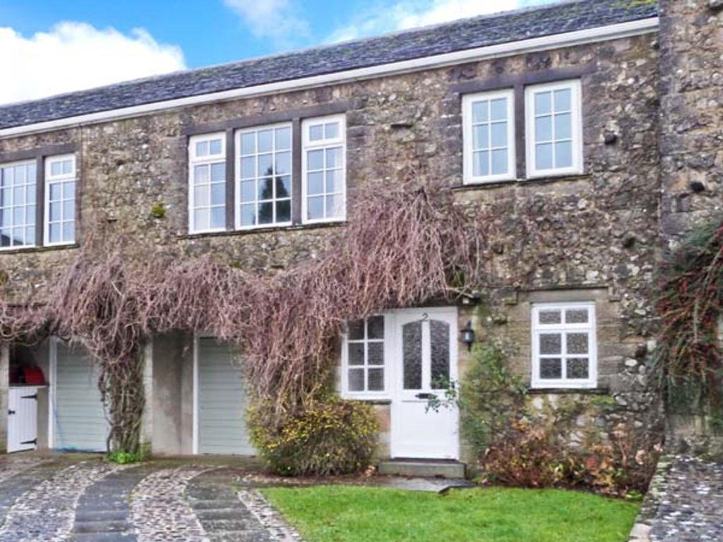 a brick house with white doors and windows at 2 Dalegarth in Skipton