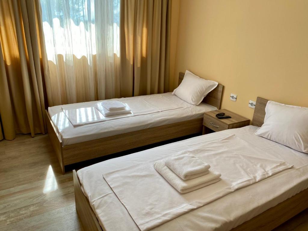 Postel nebo postele na pokoji v ubytování Hotel Sunrise