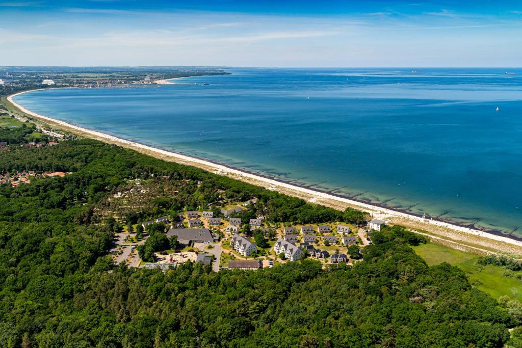 an aerial view of a beach next to the water at StrandResort Markgrafenheide in Warnemünde