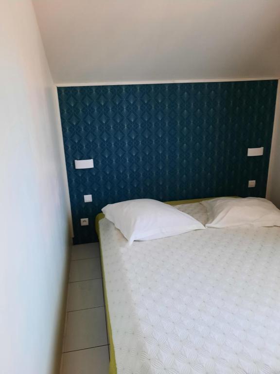 Postel nebo postele na pokoji v ubytování GÎTE Le Calou Pilon