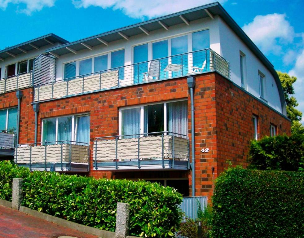 a brick building with balconies on top of it at Auszeit in Eckernförde