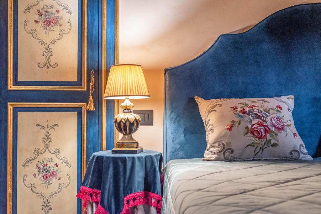 Postel nebo postele na pokoji v ubytování Bar Vitelli Charming suites