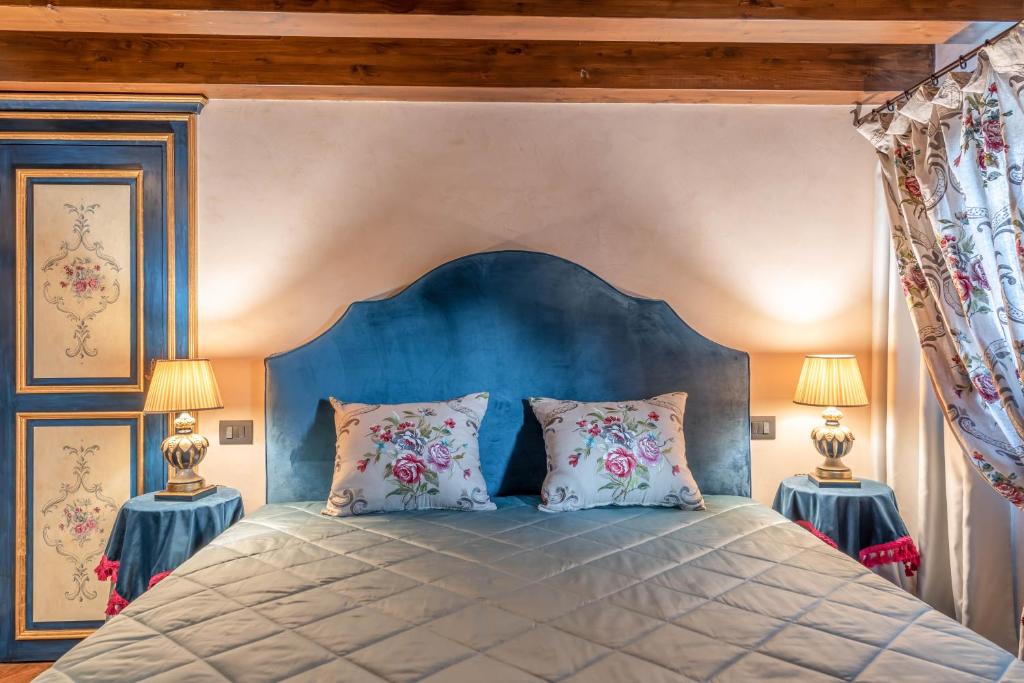 Postel nebo postele na pokoji v ubytování Bar Vitelli Charming suites