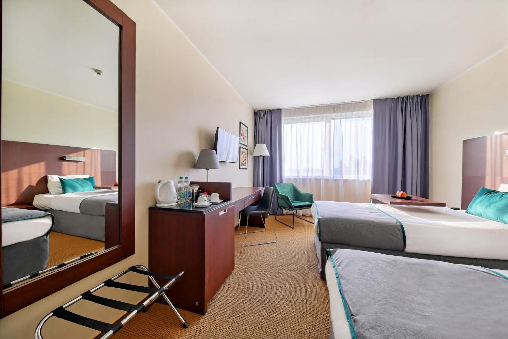 Posteľ alebo postele v izbe v ubytovaní Mercure Warszawa Airport